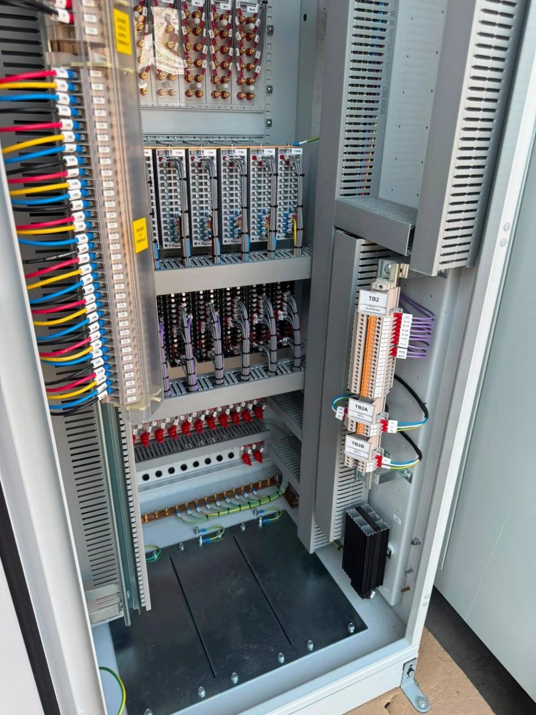 Protection panel during build, showing ferruled wiring, test blocks and labelled terminal rails