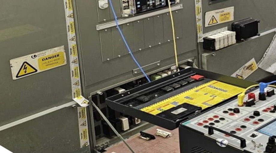 Protection test set connected to 33kV switchgear panel